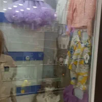 فروش لباس بچگانه واگذاری مغازه با دکور وجنس
