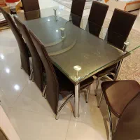میز ناهار خوری پایه استیل و صندلی چرم