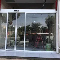 ساخت ونصب درب شیشه ای کشویی اتوماتیک مغازه،ساختمان