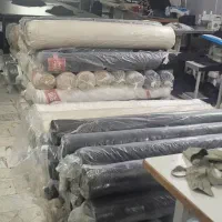 اتو کار و بسته بند خانم در کارگاه خیاطی