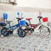 ۲ عدد دوچرخه ۱۲ سالم تمیز همراه کمکی پشتی و صندوق