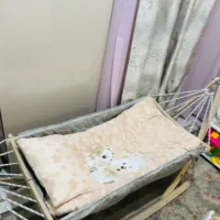 گهواره چوبی  وکریر نوزاد