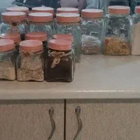 جا حبوباتی شیشه ای طرح دار درب فلزی صورتی