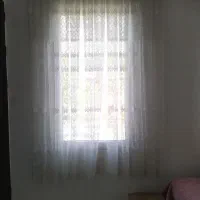 پرده توری و کنار سالنی