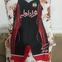لباس و کفش کشتی.ودو جفت کفش فوتبال