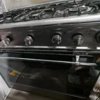 اجاق گاز طرح فرصفحه شیشه ای مشکی