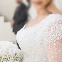 لباس عروس پرنسسی با سنگ‌دوزی دستی پشت بندی