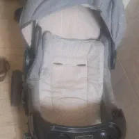 کالاسکه و کریر ، صندلی کودک و تعدادی عروسک و جغجغه