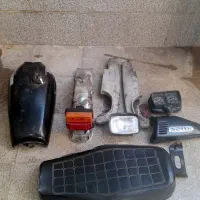 قطعات موتور کار کرده از جمله زین . باک و ...