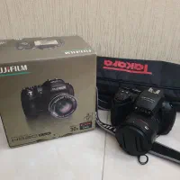 دوربین عکاسی - فیلمبرداری FUJIFILM و سه‌پایه عکاسی