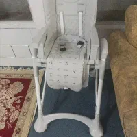 یه صندلی کودک و یه عدد گهواره آنجل