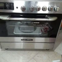 اجاق گاز استیل ۵ شعله فردارباجوجه گردان‌پایلوت