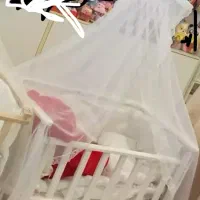 گهواره نوزاد تخت کنار مادری