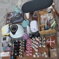 لوازم کامل ناخن کاری و چراغ مطالعه شارژی