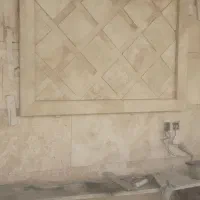 اجرای سنگ کاری بغل پله پارکینگ نما دو اسانسور
