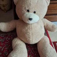 عروسک و اسباب بازی و راکت بدمینتون