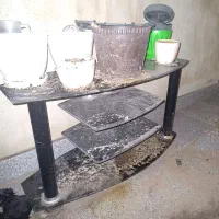 میز شیشه ای زیر تلویزیون مشکی زیبا