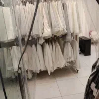 اتو کار پرده بر دست خیاط