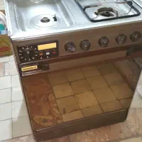 اجاق گاز چهار شعله تکنو گاز با فر و جوجه گردان