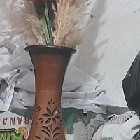 فروش گلدان و گلهایش
