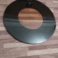 شیشه ۶میل قهوه ای روی میزی دایره ای