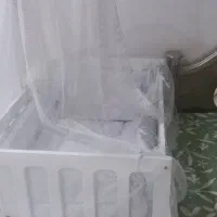 گهواره کنار مادر