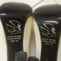 کفش مجلسی|کیف، کفش، کمربند|قم, وادی السلام|دیوار