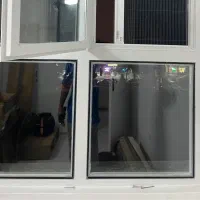 نصب شیشه دوجداره روی پنجره آهنی