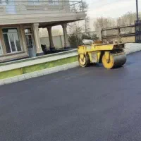 پخش تراشه آسفالت غلطک