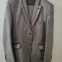 تعدادی کت شلوار و لباس مردانه نو
