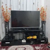 فروش زیر تلویزیونی با گل وگلدان