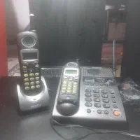 تلفن بی سیمو قاب ساعت دیواری وچند عروسک