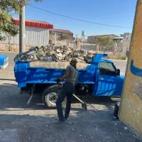 حمل خاک نخاله مصالح  نیسان کمپرسی اتاق بزرگ‌.