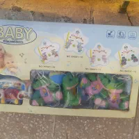 تاب و پشه بند و موزیکال بالای تخت نوزاد