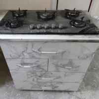 گاز رومیزی با کابینت زیر آن