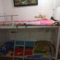 تخت خواب فلزی بعضی جاش چوبی دوطبقه