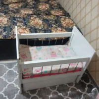 گهواره کنار تخت مادر
