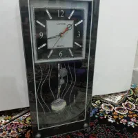 ساعت دیواری آونگ دار