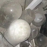 هفت عدد گلدان شیشه ای