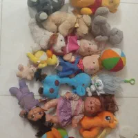 تعدادی عروسک اسباب بازی پولیشی ارزان کودک