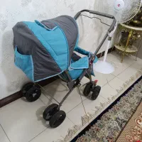 یه‌‌کالسکه‌‌ آبی‌‌چرخ‌سالم