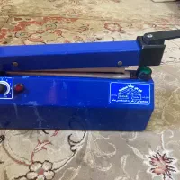 دستگاه پرس با دوخت پلاستیک در حد نو