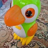 طوطی موزیکال که راه میره و میچرخه