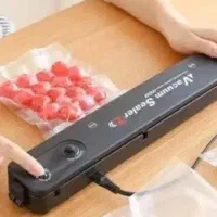 دستگا ه بسته بندی و وکیوم مواد غذایی برقی