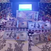 دلار.دینار و پول تزئینی