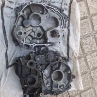 پوسته های وسط هندا و میل لنگ و درب کلاچ و برق