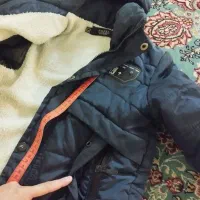 کاپشن|کفش و لباس بچه|قم, قلعه کامکار|دیوار