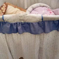 گهواره نوزاد به همراه قنداق سویسی