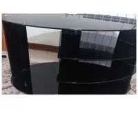 میز شیشه ای زیر تلویزیون