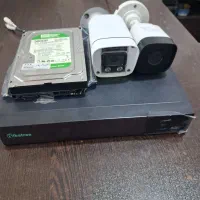 دوعدد دوربین به همراه هارد و دستگاه